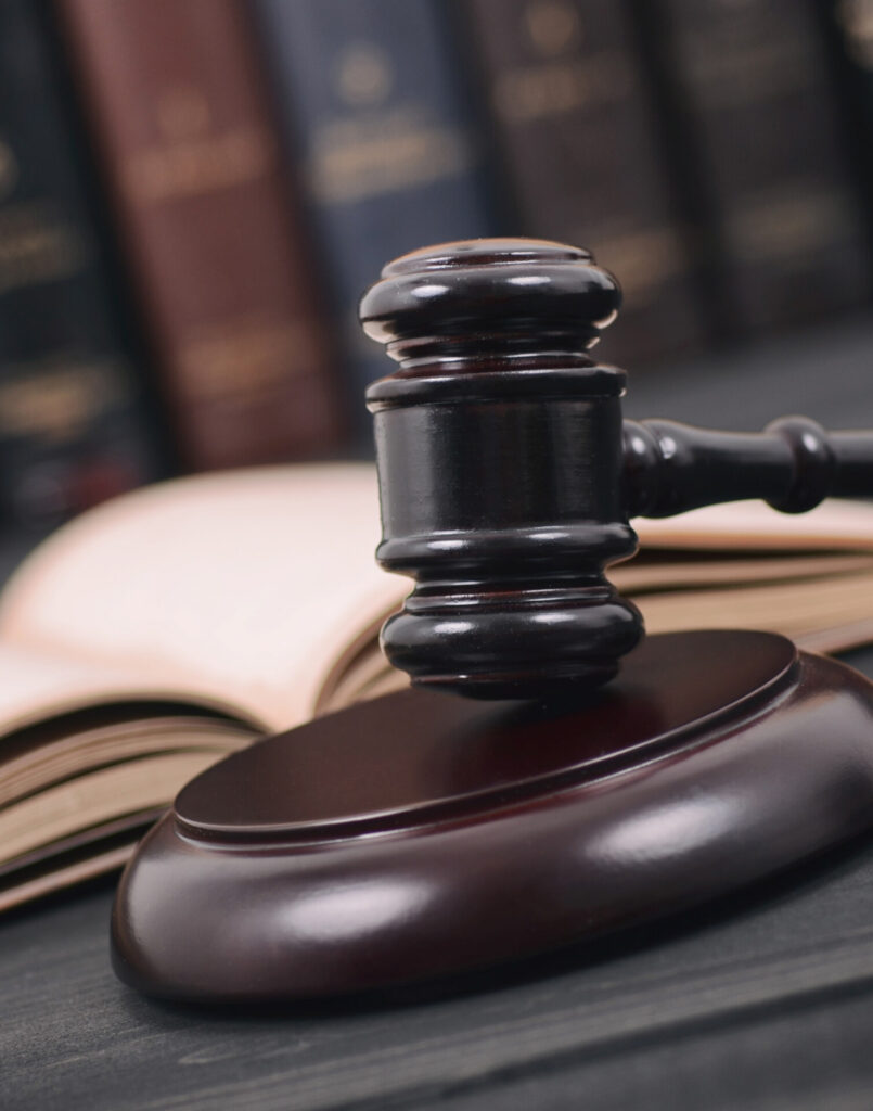 Law and Justice , Legality concept, Judge Gavel and law book on a black wooden background, law library concept.